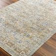Close-up angled view showing the rug's flat texture and worn vintage look on hardwood floor