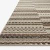 Close-up angled view of the corner edge of the Rainier Ivory Taupe rug showing detailed woven texture.