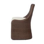 Side profile highlighting the smooth curve and woven texture of the frame with cushioned seat
