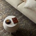 Top view of coffee table on Heritage Lagoon Tobacco rug highlighting rich colors and pattern details