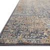 Close-up angled view showing the textured pile and detailed border pattern of the rug’s corner
