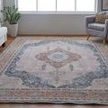Rug in living room from slightly angled top view with furniture framing the space
