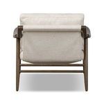 Rear view revealing sling fabric supporting back cushion and tapered oak leg details