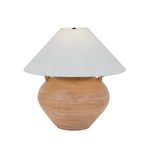 Civita Table Lamp turned on showing warm illumination through ivory linen shade and terracotta base