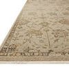 Close-up low angle showing fringe edge and detailed floral border of the Giada Silver Sage Rug