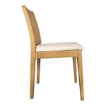 Side profile showing slim wood legs and beige cushion thickness on Orville dining chair