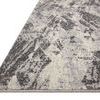 Low angle close-up showing thin profile and edge finish of Austen Stone Pebble rug