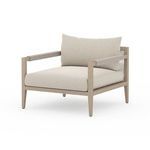 Angled side view displaying armrest wrapping and frame depth
