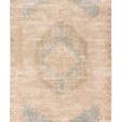 Traditional rectangular rug with a vintage-inspired tan and blue center medallion pattern on a distressed jute weave