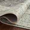 curled edge of rug highlighting flexible polyester weave and close-up of textured printed design
