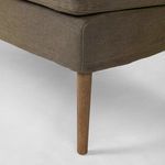 Close-up of smooth oak tapered leg angled to show grain and finish