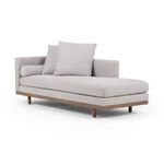 Right angled view of chaise highlighting extended seat cushion and wooden leg positioning