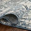 Close-up of folded corner displaying dense weave and backing of Austen Ocean Rug