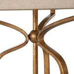 Close-up detail of curved metal base joint in Ashwell Gold finish