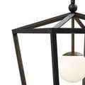 Close-up showing hammered texture on black powder-coated wrought iron frame and glass globe detail