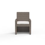 Front view of Coronado Dining Chair showing full cushion and straight wicker weave