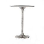 Full frontal view of the bar table highlighting the silhouette of tulip base and thin top