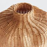 Close-up view of woven neck and opening showing intricate tight palm rattan weave