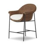 Right side angle showing rounded back and seat of woven outdoor stool with iron legs