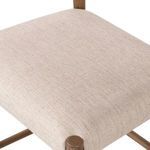 Close-up of the textured light cotton-linen blend upholstery on the square seat