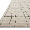 Low angle side view showing thin profile and edge detail of Darby Sand / Dk. Grey rug