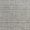 Traditional power-loomed rug featuring muted gold and blue abstract and traditional motifs in a blended pattern