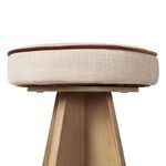 Bottom-up view focusing on the padded circular seat with brown piping atop the wooden base