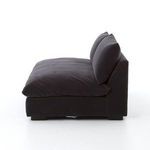Grant sectional corner piece displayed in cozy living room setup with abstract wall art and wooden furniture