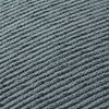 Close-up of nubby woven light blue fabric texture with beige flange edge