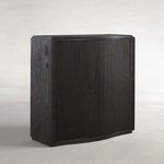 Compact Theodore Short Console table with ribbed oak veneer and wave-front silhouette in dark finish.