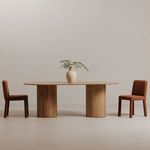Two Place Dining Chairs flanking a wooden dining table with a decorative vase.