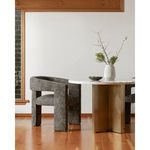 Elo Chair paired with marble top dining table in minimalist room with wood floors