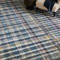 Close-up of Humphrey Plum rug showing plush texture and mix of muted blue, purple, and yellow plaid stripes