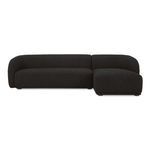Faye sectional sofa in black boucle with curved back, firm fixed bench seat, and rounded rubberwood legs