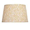 Close-up showing pleated yellow and white ginkgo leaf fabric with sewn edging on lamp shade