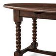 Angle view focusing on spiral turned legs and rounded edges of oval tabletop