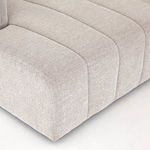 Close-up of rounded corner seat and dense fabric texture on sectional’s seating area