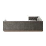 Side view with smooth upholstery on outside arm and nailhead trim