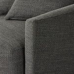 Close-up of soft fabric upholstery on squared armrest and front cushion seam