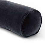 Angle showing rounded end of navy bolster pillow with smooth velvet finish