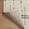 Lifted corner exposing tightly woven backing with grid weave on Darby Sand / Dk. Grey rug