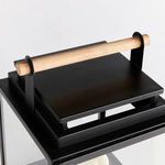 Close-up side angle highlighting the lantern’s black metal top and the full length of the teak handle