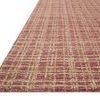 Low angled side view emphasizing the rug's thickness and textured gridded weave.