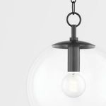 Close-up of Old Bronze steel fixture and exposed filament bulb inside clear glass globe