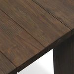 Close detail of brown wood slats with natural grain on tabletop corner