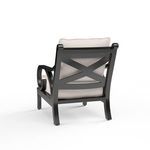 Rear view of Monterey Club Chair featuring black cross-back aluminum frame and cushion detail