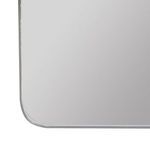 Close-up of bottom rounded corner with brushed silver frame detail