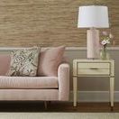 Hunter 2-Drawer Side Table styled in a living room next to pink velvet sofa with lamp and flowers on top