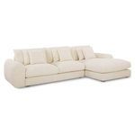 45-degree angled view of Berga Sectional showing plush cushions and smooth beige fabric