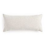 Pillow back view showing fully textured off-white fabric with zipper detail